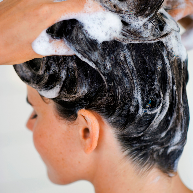 How does over-shampooing your hair contribute toward hair breakage?
